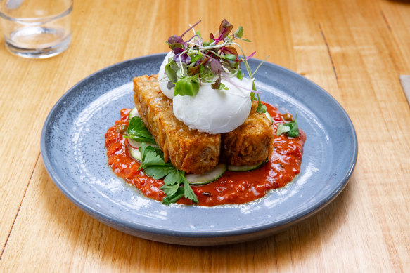 Cassette’s house-made potato rosti with charred capsicum and tomato caponata, fresh zucchini and two poached eggs. 