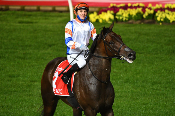 A smiling Luke Currie and Hey Doc after winning the Manikato Stakes at Moonee Valley on Friday night.