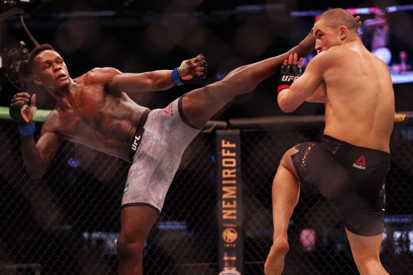 Israel Adesanya (left) was too strong for his Australian rival. 