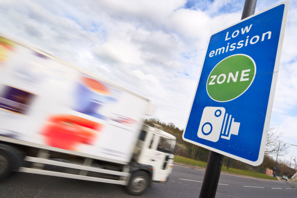 A sign warns drivers of a low-emission zone in the UK.