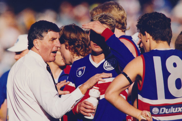 The coach’s word is gospel as Footscray players listen intently.