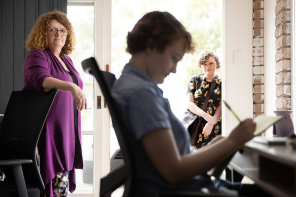 Kylie Hughes with her daughters Ellen (centre), who is completing VCE over two years through virtual school, and Georgia, who has switched to an alternative school.