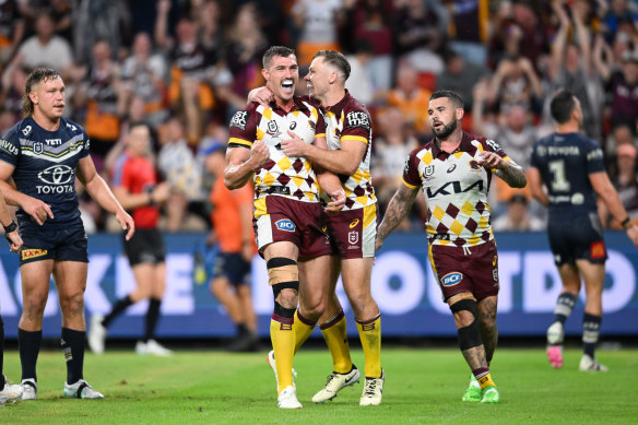 Despite the strapping, Corey Oates – pictured celebrating with the Broncos on Friday – says his knee is “the best it’s felt in a long time”.