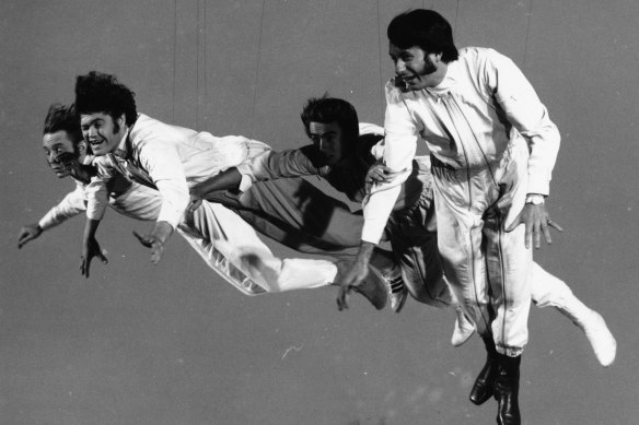 Pop band ‘The Monkees’, left to right, Davy Jones, Micky Dolenz, Peter Tork and Mike Nesmith, filming a flying sequence for the television show, circa 1968. 