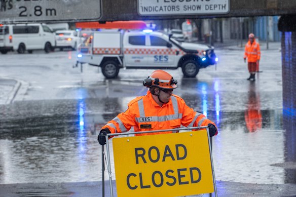 SES workers block the bridge at York St. South Melbourne.