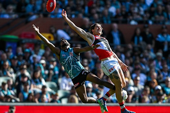Liam Stocker flies against Port’s Willie Rioli for the ball.