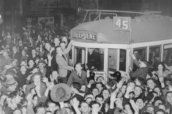 A crowd celebrates Japan's surrender on a tram in Melbourne, 1945.