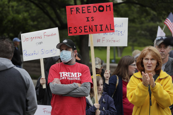 Protesters rally at the Texas State Capitol in Austin to speak out against the state's handling of the COVID-19 outbreak.