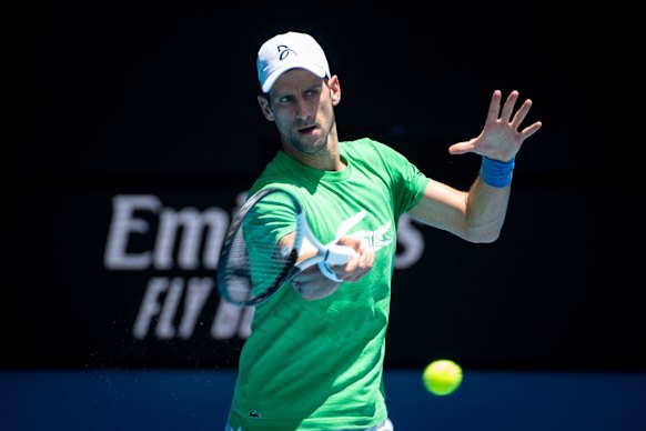 Novak Djokovic trains in the Melbourne heat on Thursday as he awaits a decision on the status of his visa.