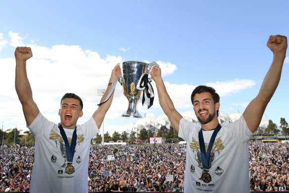 The Daicos boys, Nick and Josh, with the 2023 premiership cup.