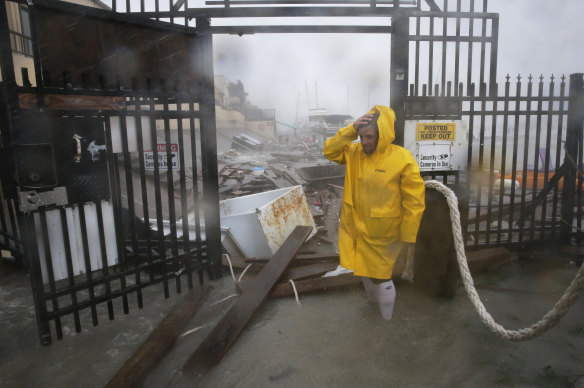 Jame Rowles examines the damage after the docks at the marina where his boat was secured were destroyed as Hurricane Hanna made landfall, in Corpus Christi, Texas. 