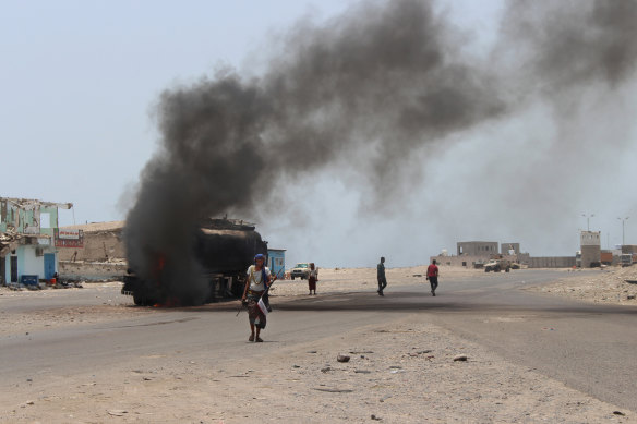 An oil tanker truck burns following recent clashes between Yemeni southern separatists and government forces near Aden, Yemen.