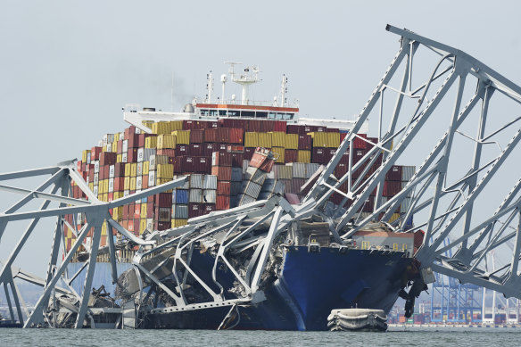 Cargo ship Dali stuck under a piece of the collapsed Francis Scott Key Bridge.