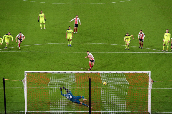 Billy Sharp scores just the ninth goal of Sheffield United's Premier League season.