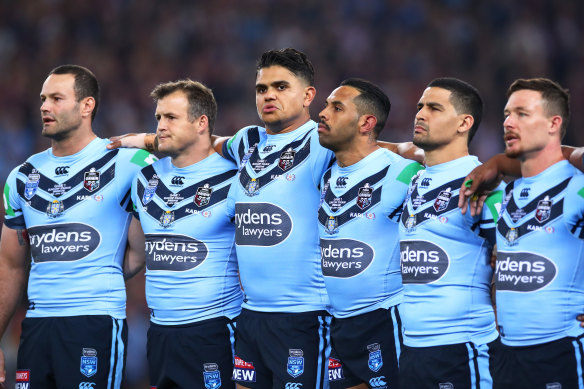 Mitchell among his NSW teammates at the singing of the anthem during Origin last year.