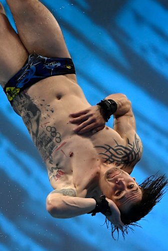 French men’s diving champion Matthieu Rosset is appropriately dressed for French pools where shorts-style bathers are banned. 