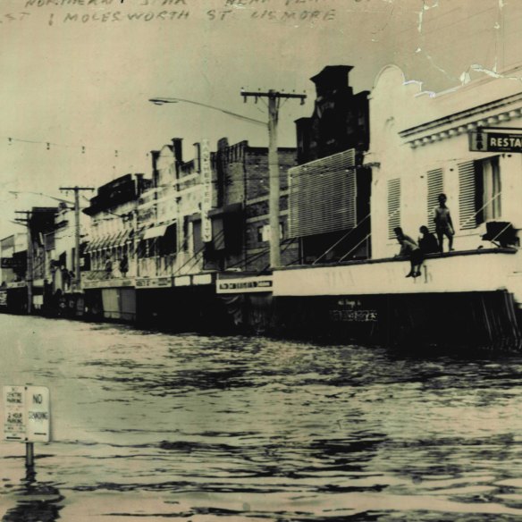 Water laps shop awnings at the height of the Lismore flood on March 12, 1974.