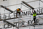 Workers prepare to take Donald Trump's name off the Kennedy Centre.