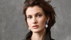 The Entrelacs Mysterieux bracelet is paired with Echo Mysterieux earrings with detachable pendants and an Echo Mysterieux ring.