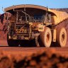 BHP posts iron ore record but warns of uncertainty