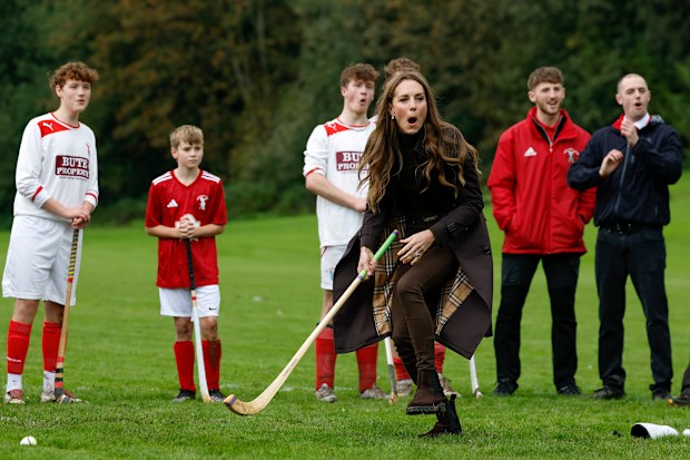 Catherine, Princess of Wales, participates in the sport on the pitch, while visiting Bute Shinty Club in Rothesay