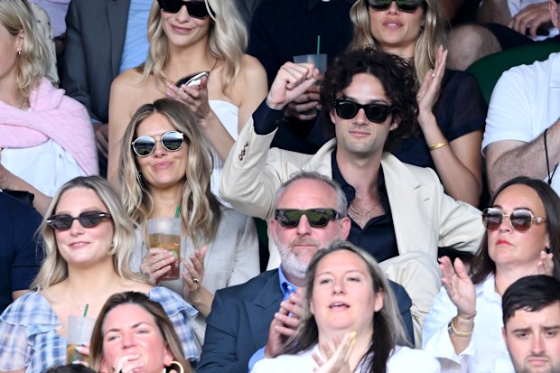 Sienna Miller and Oli Green at the 2026 Wimbledon Championships at the All England Lawn Tennis and Croquet Club, London. Saturday July 4, 2026.