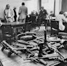 Detectives hunting for a clue to the robbery showed this arsenal of machine guns to bookmakers and members of the Victorian Club.