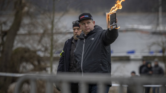 Rasmus Paludan burns the Koran outside of the Turkish embassy in Stockholm, Sweden, last weekend.