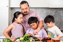 Adam Liaw cooking with his kids.