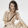 Lucy Folk “Playa Polo” jumpsuit, $675; “Cocktail” clutch, $470; “Briout” earrings, $370; “Draa” necklace, $590; “Silencio” bracelet, $375; “Anchovy” cuff, $350; “Anchovy” ring, $175; “Silencio” ring, $195. Prada shoes, $1290. 