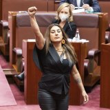 Deputy Leader of the Australian Greens in the Senate, Senator Lidia Thorpe, approaches the table to be sworn-in, in the Senate at Parliament House in Canberra.