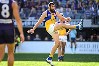 Josh Kennedy kicks for goal.