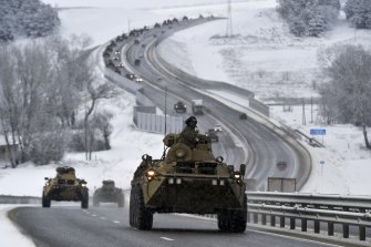 A convoy of Russian armoured vehicles moves along a highway in Crimea on January 18. 
