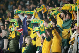 Fans cheer during the World Cup qualifier between the Socceroos and Saudi Arabia at CommBank Stadium on Thursday.