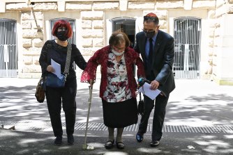 Eddie Jaku’s widow Flore departs the service for the Holocaust survivor on Wednesday.