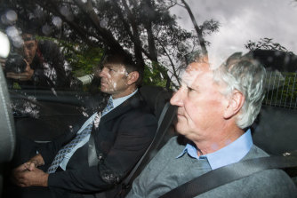 Spedding is driven to the police station after his arrest.
