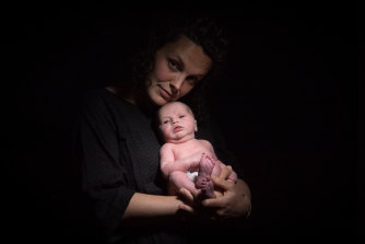 Caitlin Graham with her daughter Celeste a week after the birth.