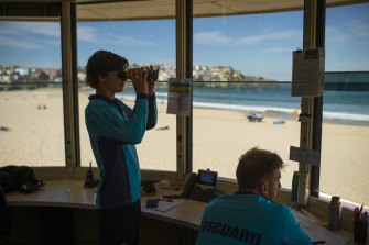 Lifeguards keep watch at Bondi Beach ahead of warmer weather this weekend. 