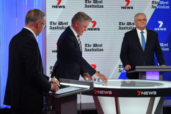 Mark Riley (centre) moderates as Scott Morrison (right) and Anthony Albanese face off in their third and final leaders’ debate.