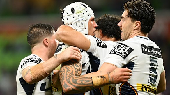 The Broncos celebrate a Jordan Riki try.