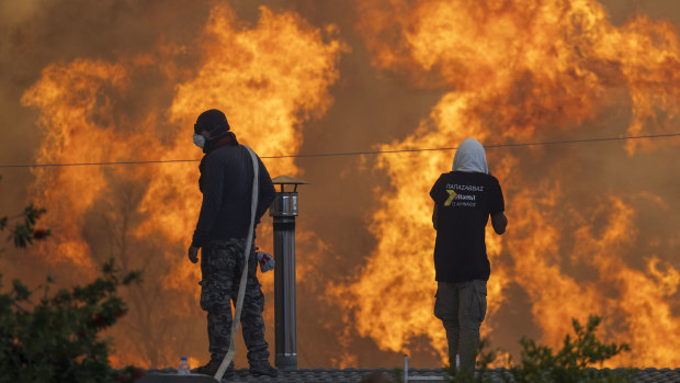 Fire approaches the Greek village of Gennadi. This year’s fires across the northern hemisphere will push up reinsurer premiums that will then hit domestic insurance prices.