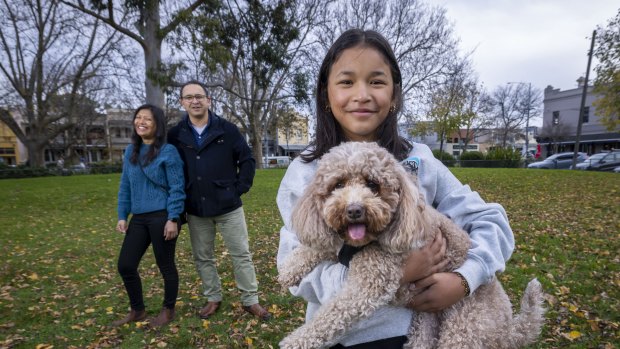 David Mazzotta and Wai Nan Khin San with daughter Zoe and Lulu the cavoodle.