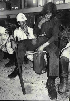 Exhausted, firefighter John Gill takes a break. October 4, 1971.