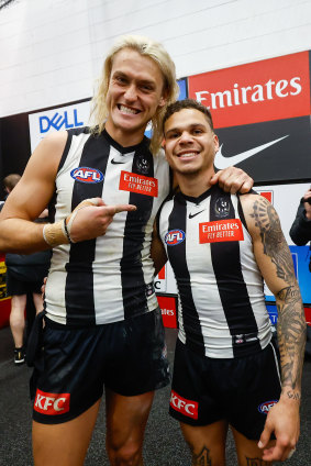 Bobby Hill with skipper Darcy Moore in the Collingwood rooms after the victory that sent them to a preliminary final.