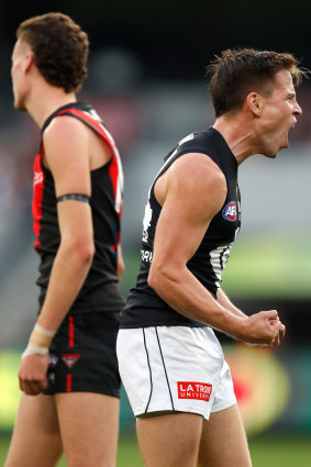 Matt Owies celebrates one of his three majors against the Bombers.