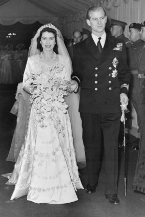 Elizabeth and Philip walk up the aisle of Westminster Abbey on their wedding day.