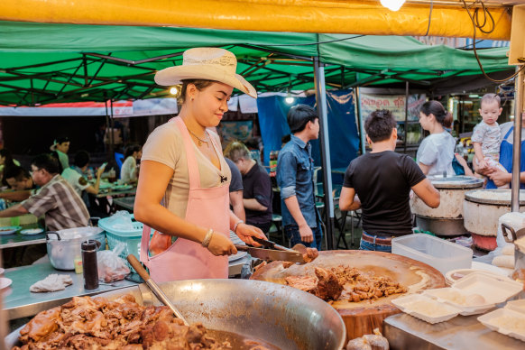 Chiang Mai’s “Cowboy Hat Lady” and her stall Khao Kha Moo Chang Phueak was made famous by Bourdain.