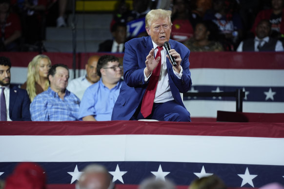 Donald Trump speaks to supporters during a town hall event at the Dort Financial Centre in Flint, Michigan. 