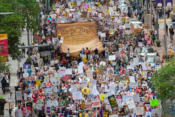 Thousands march through the streets of Houston, Texas on Saturday. 