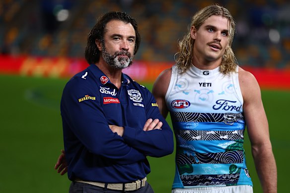 Cats coach Chris Scott and star midfielder Bailey Smith chat post-game in Brisbane.